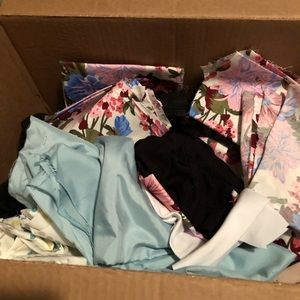 Just a box of fabric scraps, work polos, and partially deconstructed clothes